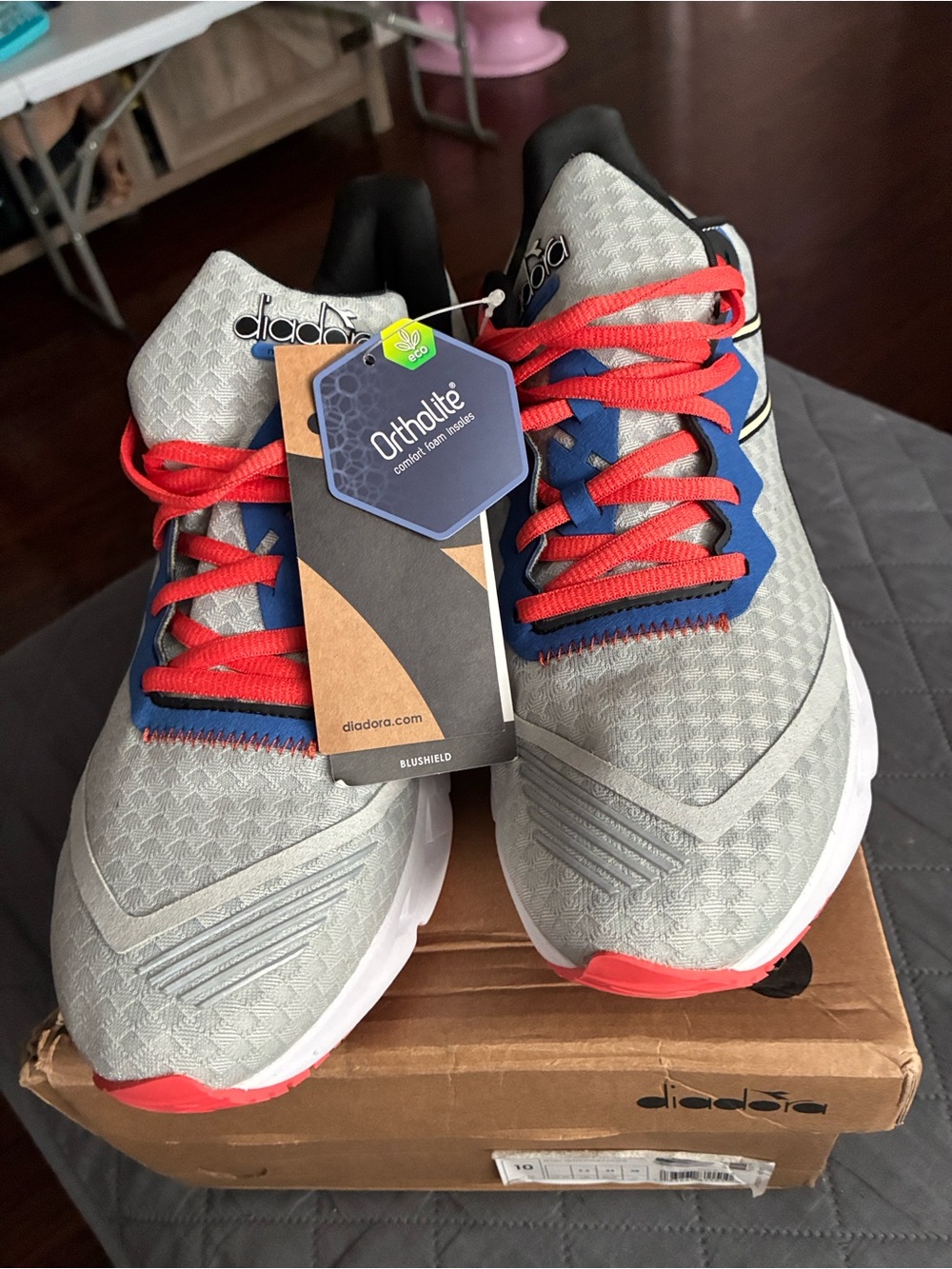 Diadora Light Gray Running Shoes with Blue Accents and Red Laces